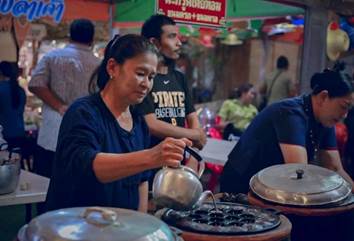 A person pouring water into a pot

Description automatically generated